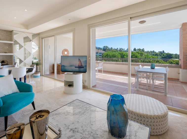 Living room and view towards the covered terrace