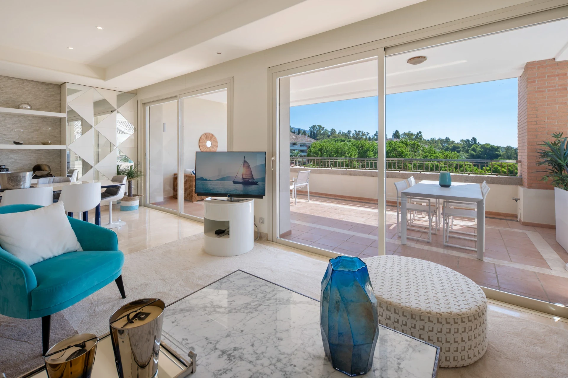 Living room and view towards the covered terrace