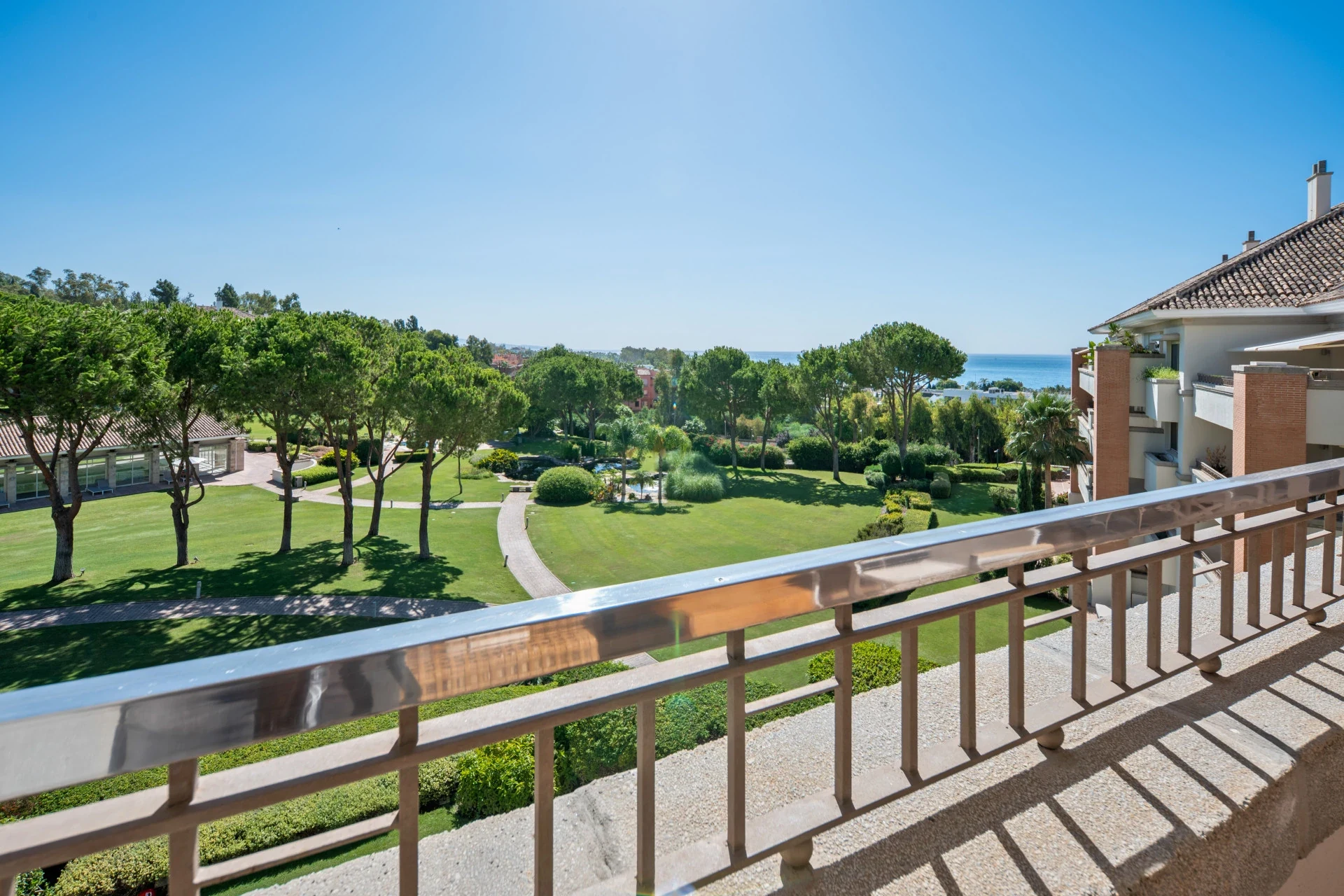 View across communal gardens towards the Mediterranean