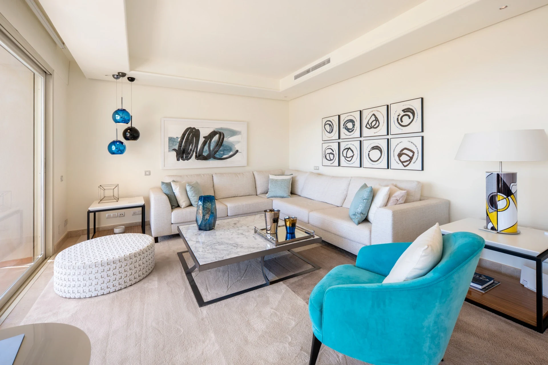 Furnished living room with floor-to-ceiling terrace doors