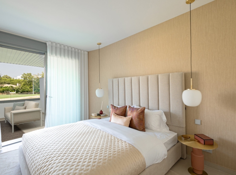Representative show-home bedroom opening onto a terrace