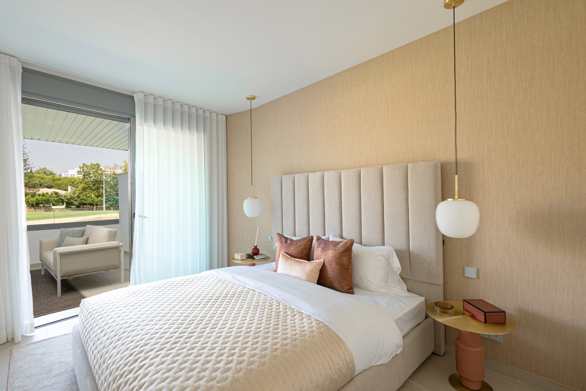 Representative show-home bedroom opening onto a terrace