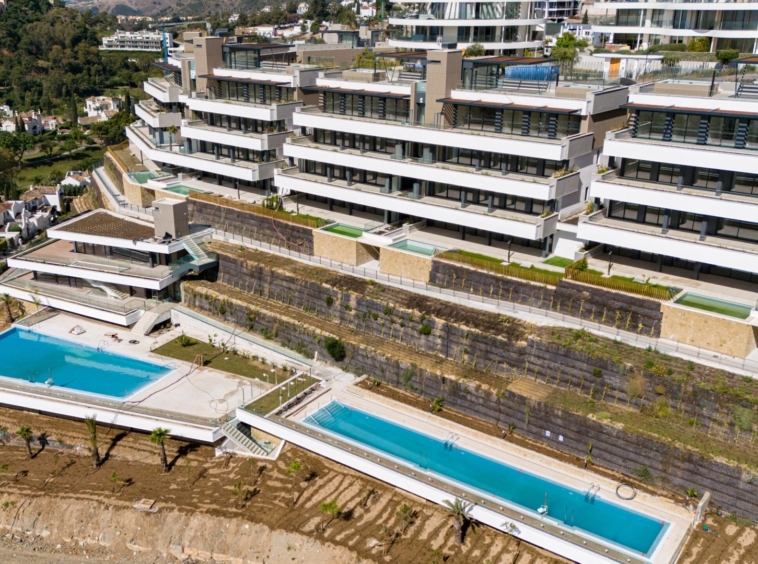 Photograph of the completed development exterior and shared pool