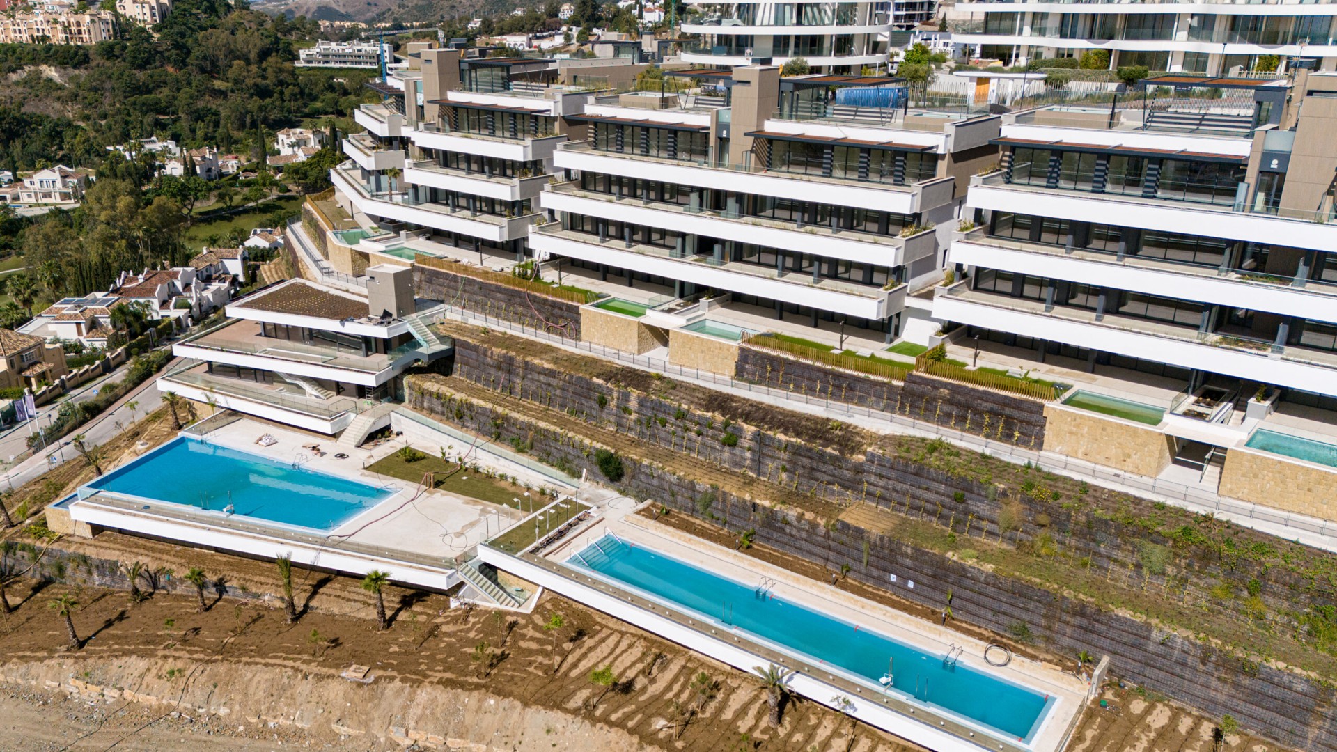 Photograph of the completed development exterior and shared pool