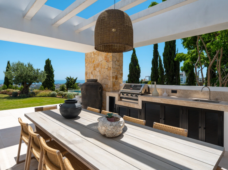 Outdoor dining area with built in barbecue