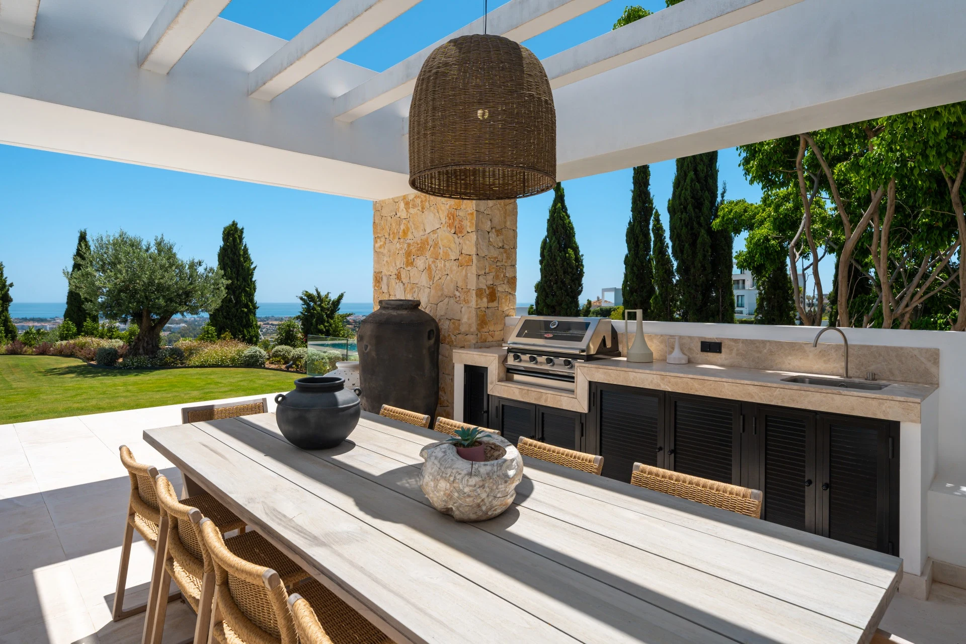 Outdoor dining area with built in barbecue