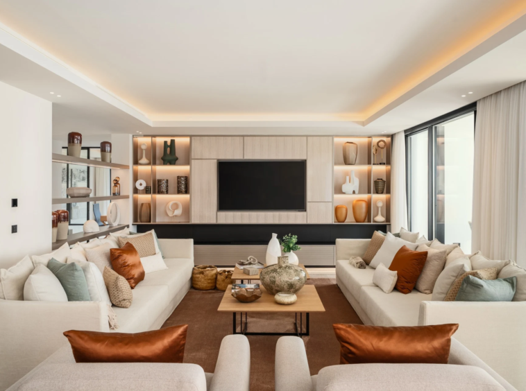 Living room with fireplace and integrated shelving