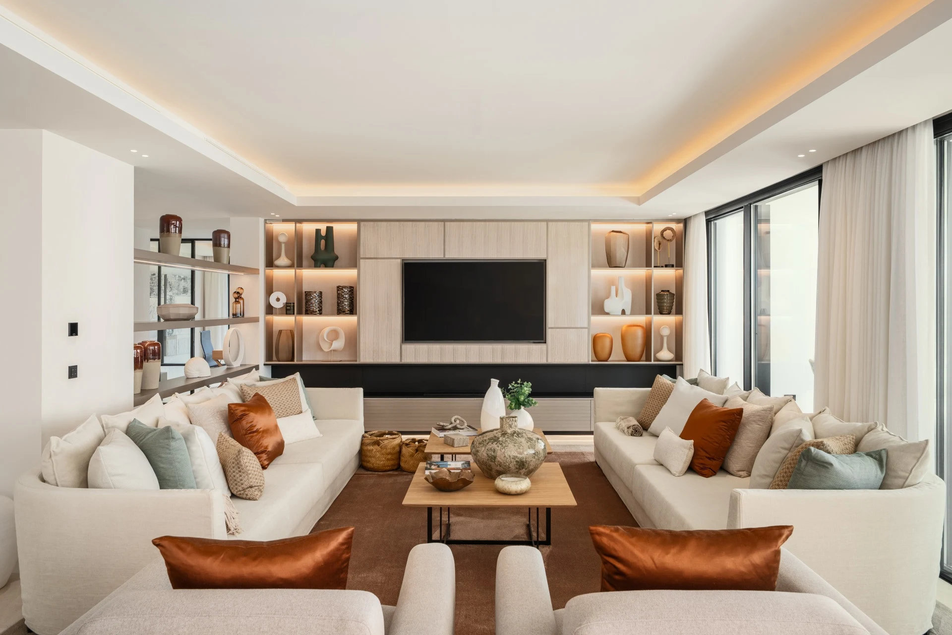 Living room with fireplace and integrated shelving