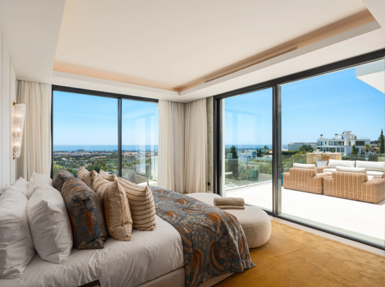 Principal bedroom with sea views and terrace access