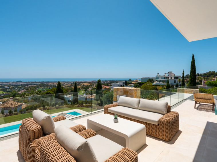 Upper terrace with seating and views towards the Mediterranean