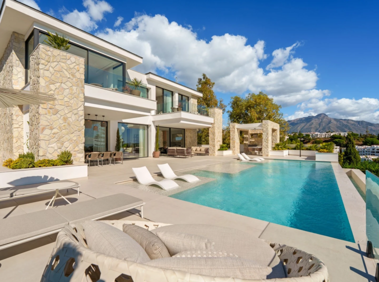 Poolside terrace beside the villa and landscaped grounds