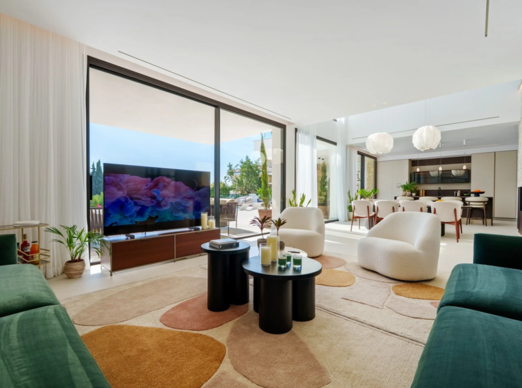 Bright living room opening onto the pool terrace
