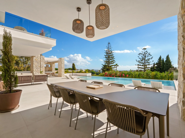 Covered outdoor dining area beside the private swimming pool