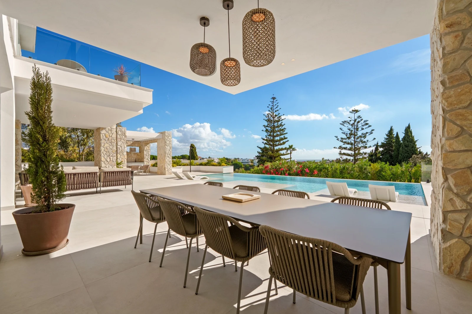 Covered outdoor dining area beside the private swimming pool