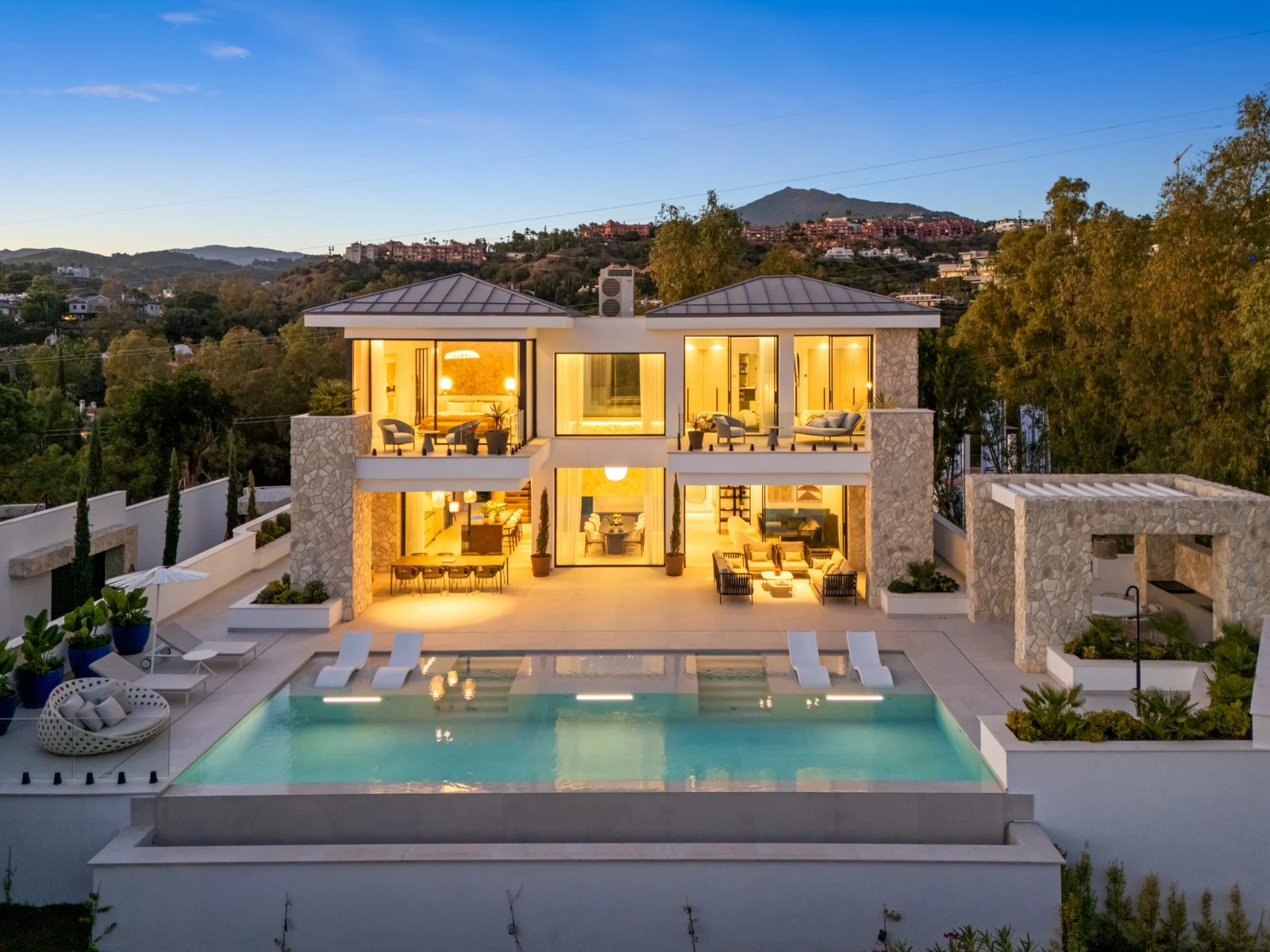 Elevated view of the villa and private pool in the evening