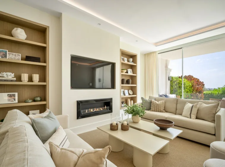 Living room with fireplace and garden access