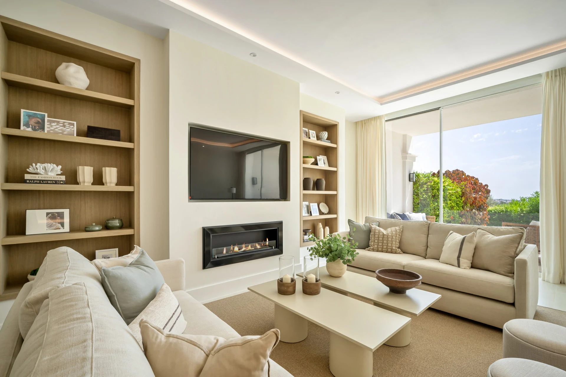 Living room with fireplace and garden access