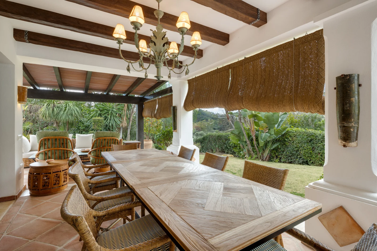 Covered terrace with an outdoor dining table