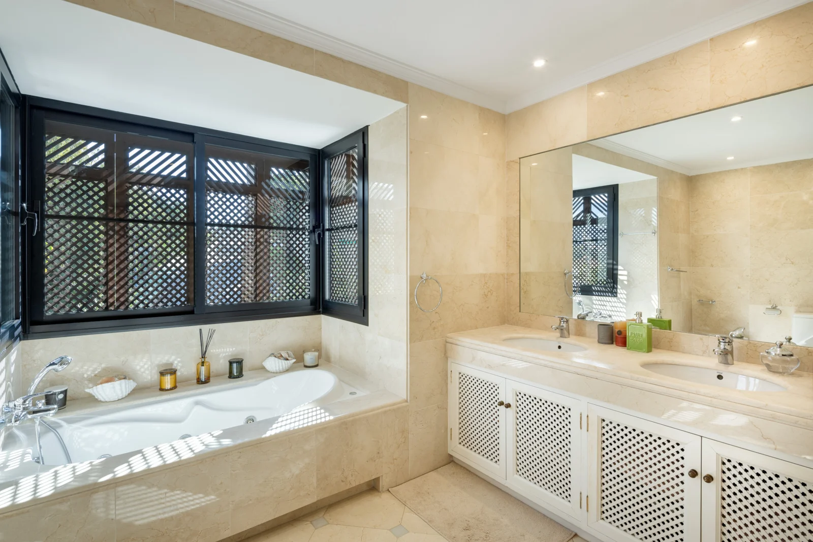 Bathroom with bathtub and double vanity