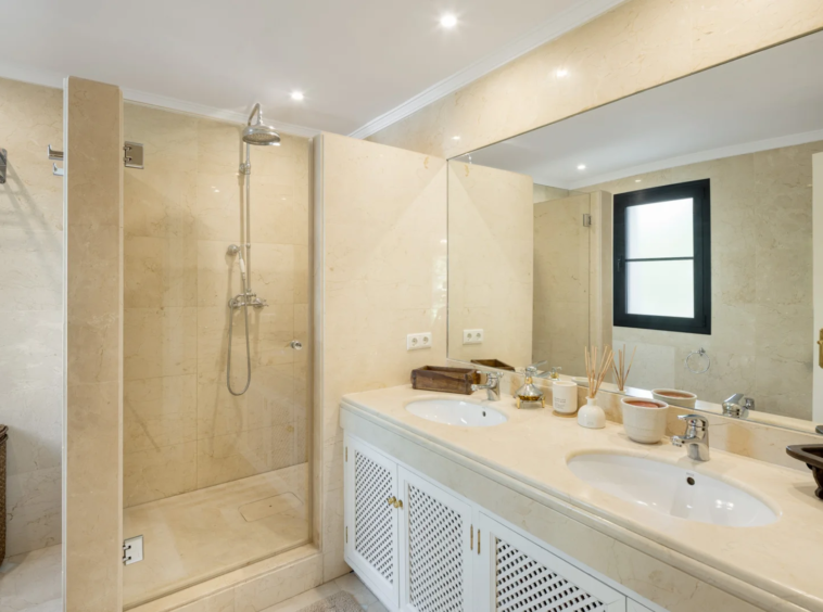 Bathroom with shower and double vanity