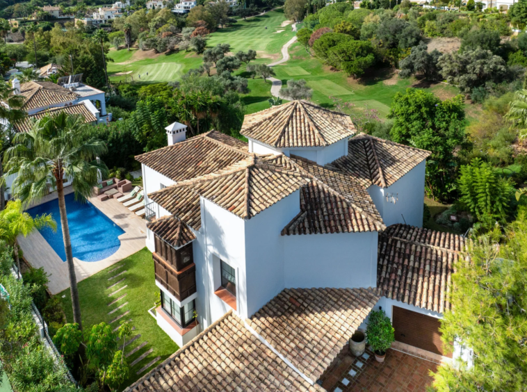 Aerial view of the villa and nearby golf course