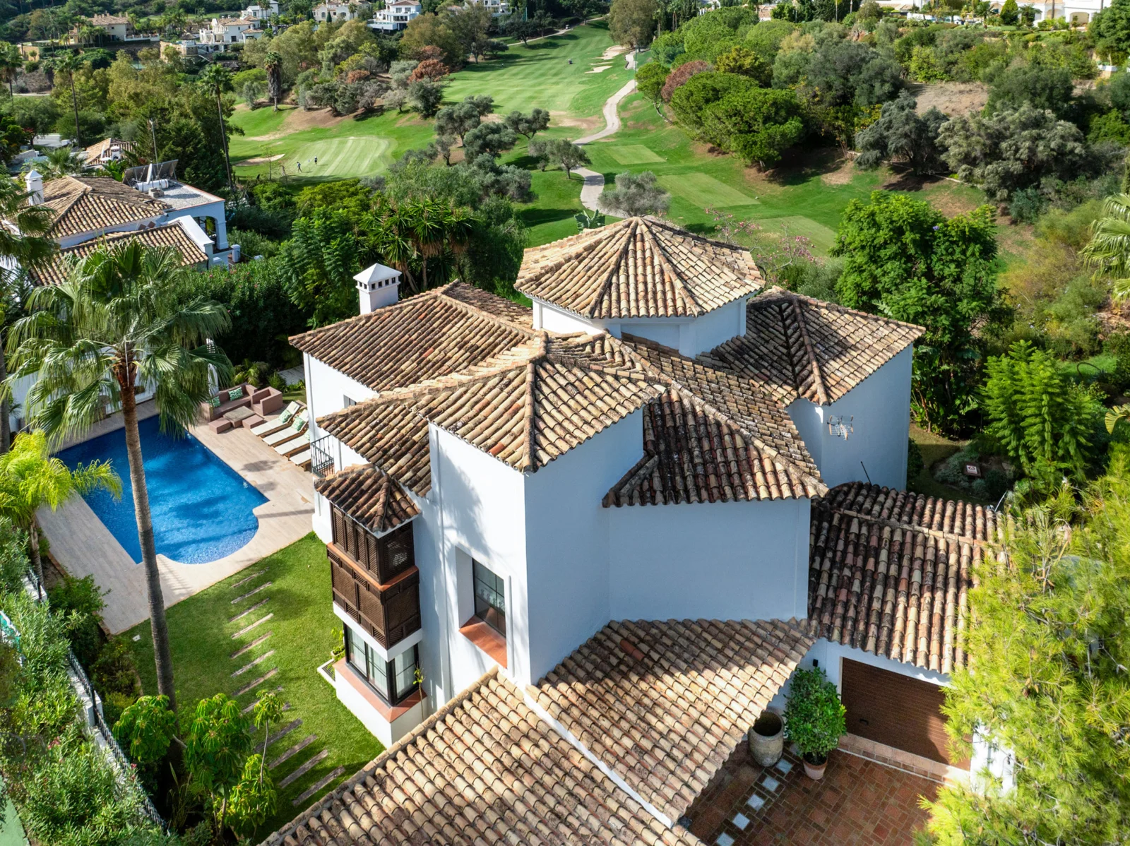 Aerial view of the villa and nearby golf course