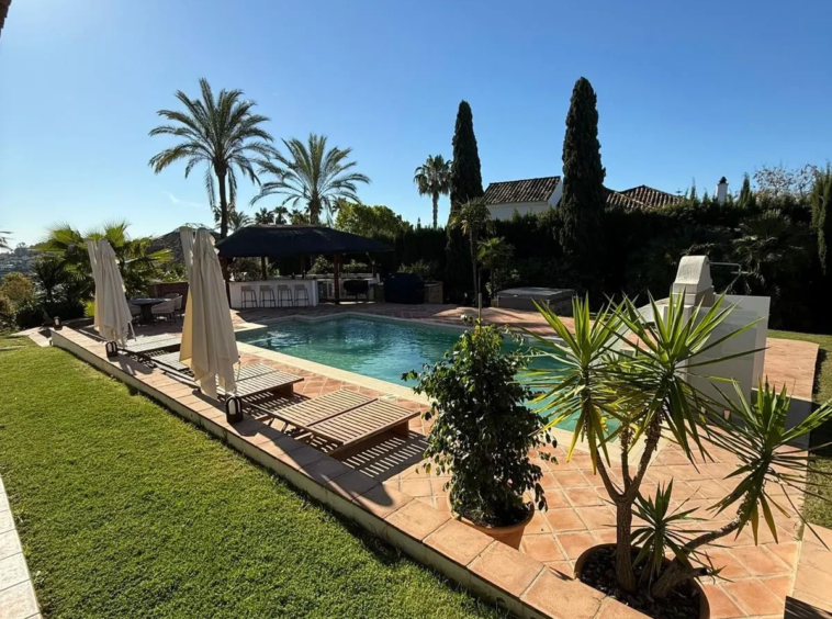 Private pool and garden with palm trees
