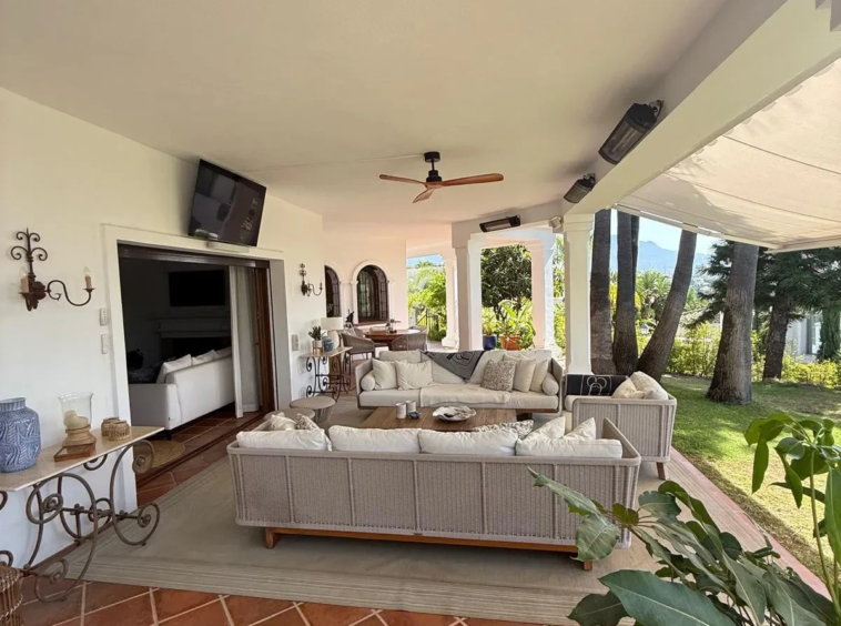 Sheltered outdoor lounge overlooking the garden