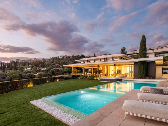 Pool and garden beside a six-bedroom villa in La Quinta at dusk