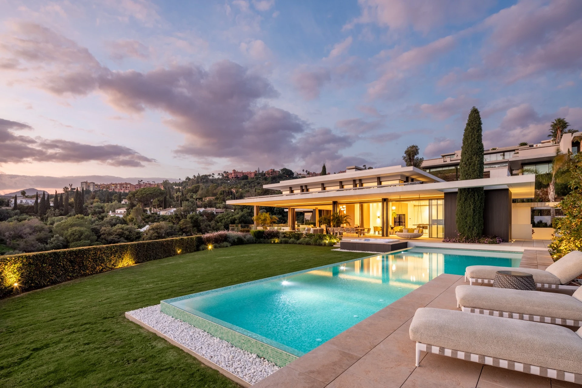 Pool and garden beside a six-bedroom villa in La Quinta at dusk