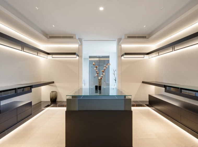 Walk-in dressing room with illuminated storage