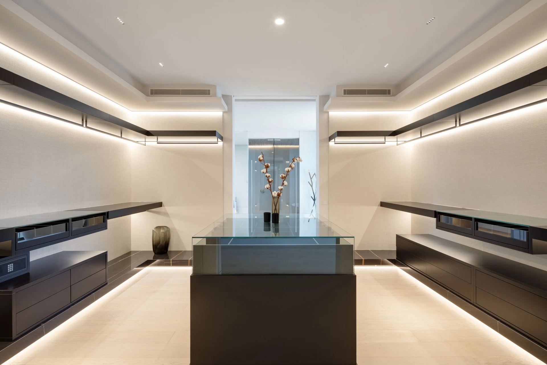 Walk-in dressing room with illuminated storage