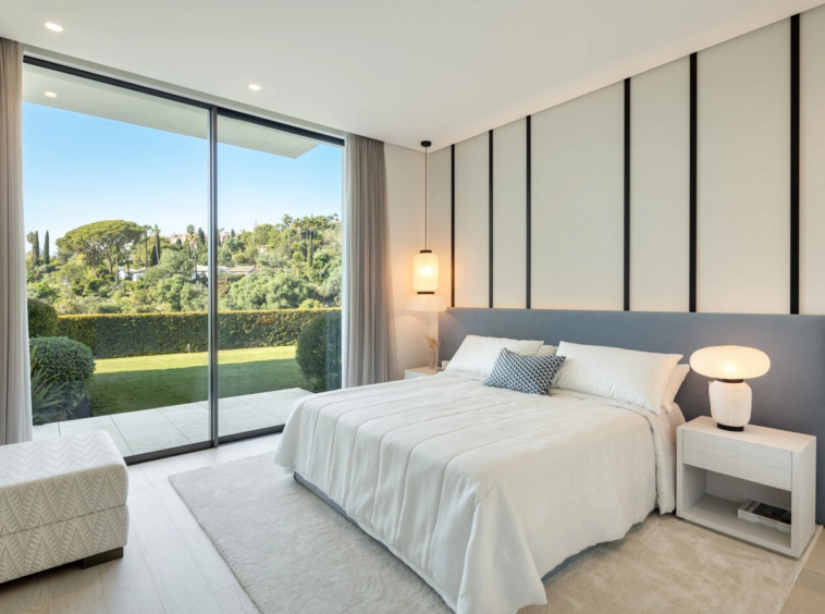 Guest bedroom with landscaped garden views