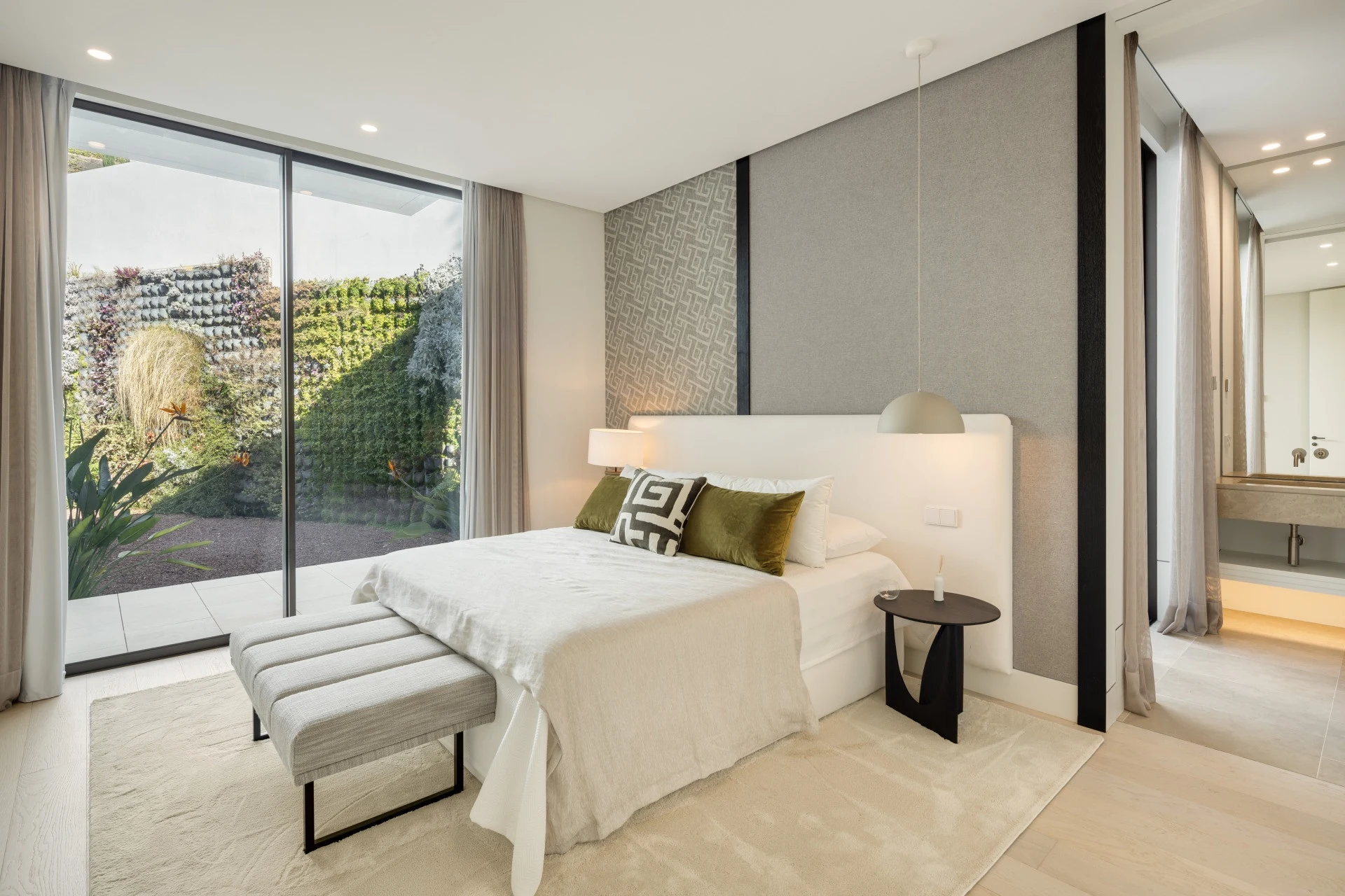 Guest accommodation with glazed doors to an outdoor area