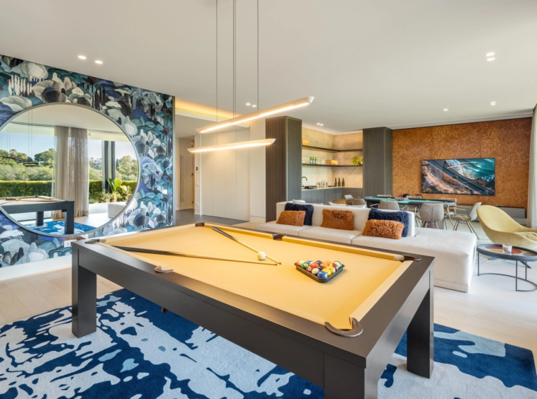 Games room with billiard table and seating