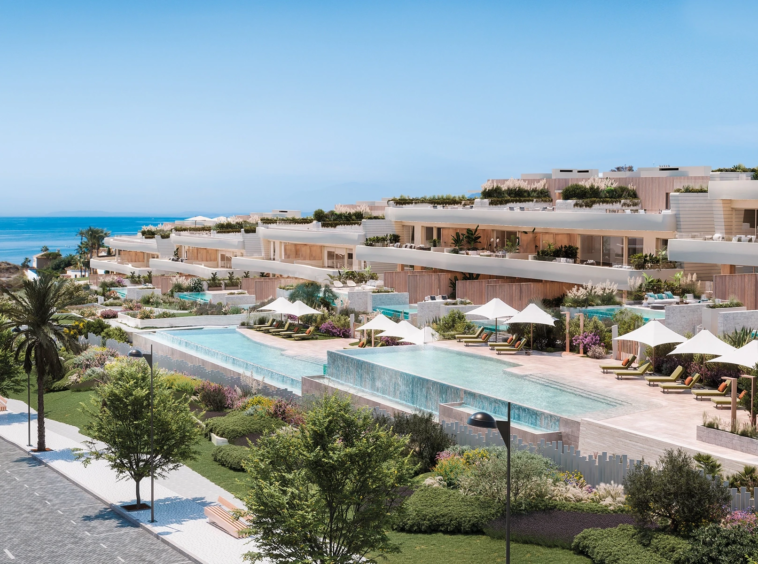 Shared gardens and outdoor pools in a beachfront community in Las Chapas