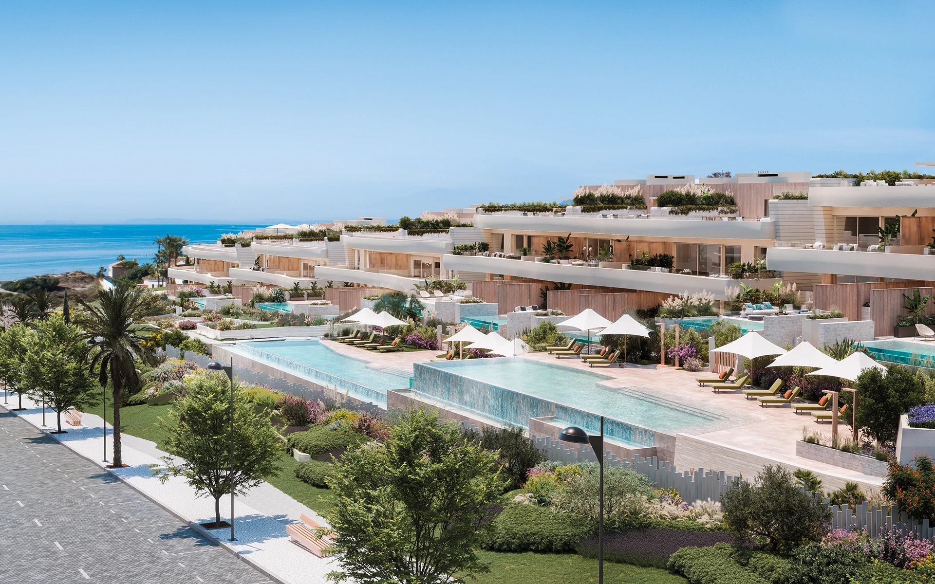 Shared gardens and outdoor pools in a beachfront community in Las Chapas