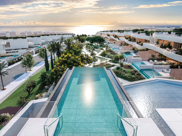 Shared rooftop pool with views across the coastal community