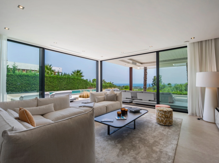 Living room with large glazed openings to the terrace