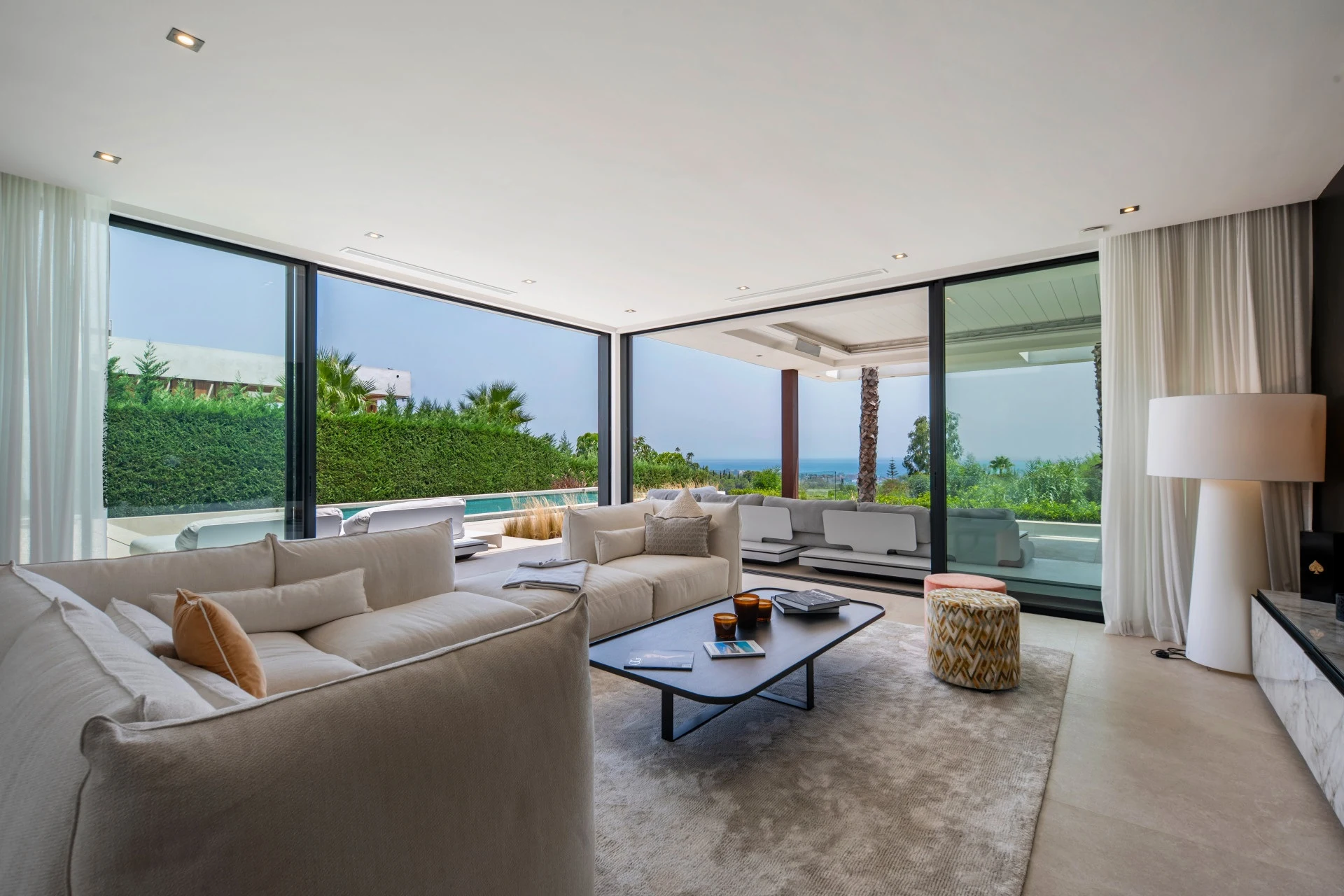 Living room with large glazed openings to the terrace