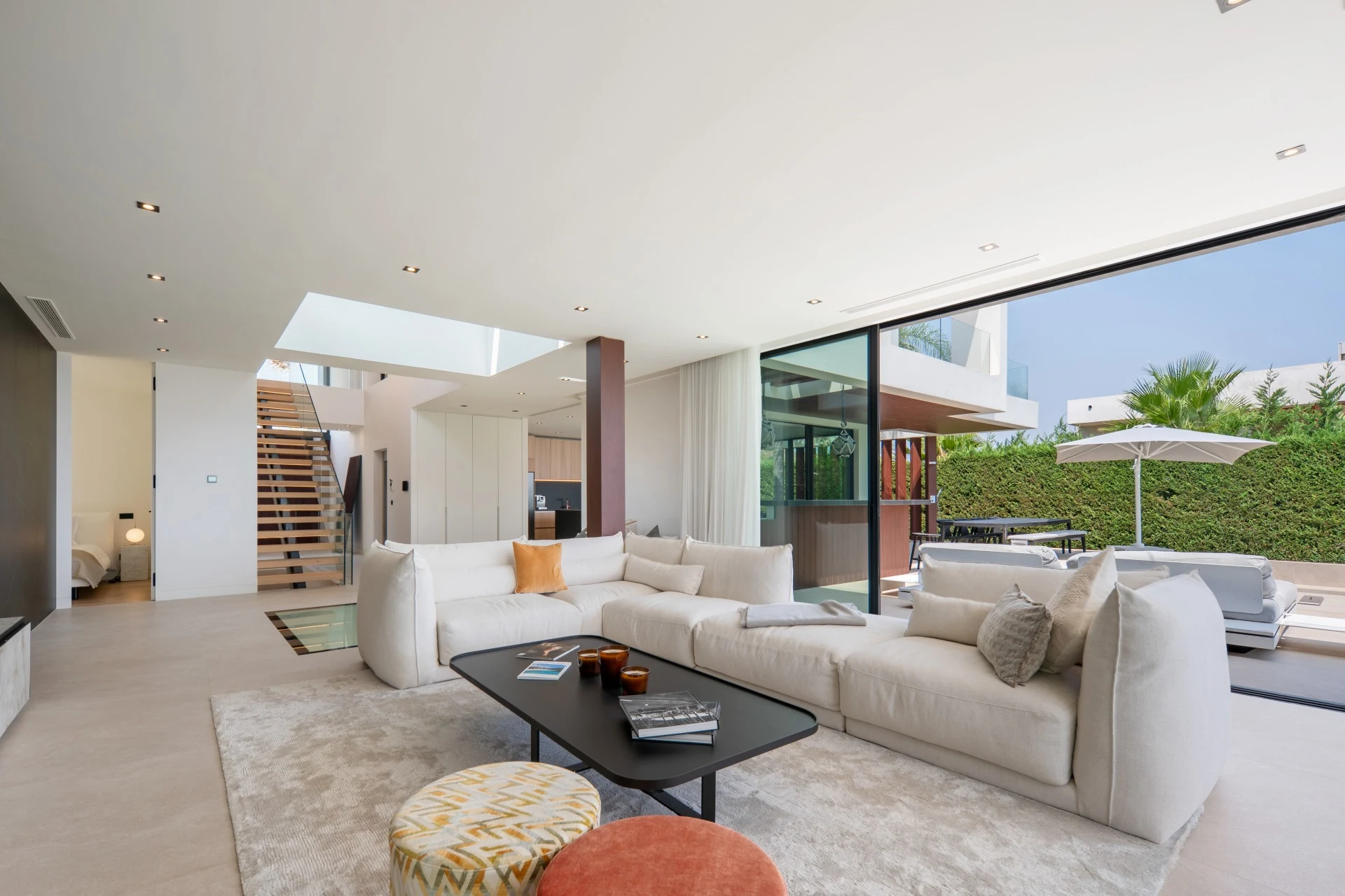 Open living area with staircase and access to the garden