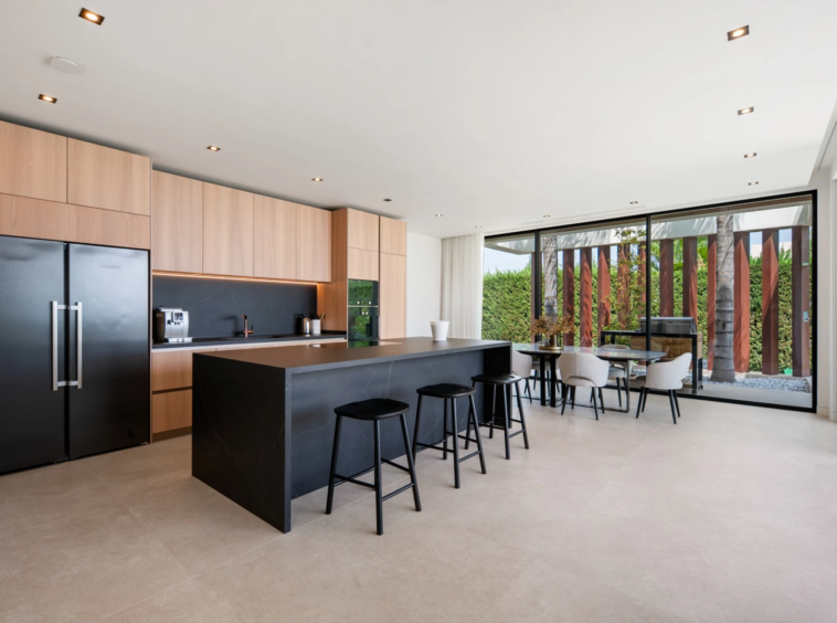 Contemporary kitchen with timber cabinetry and central island