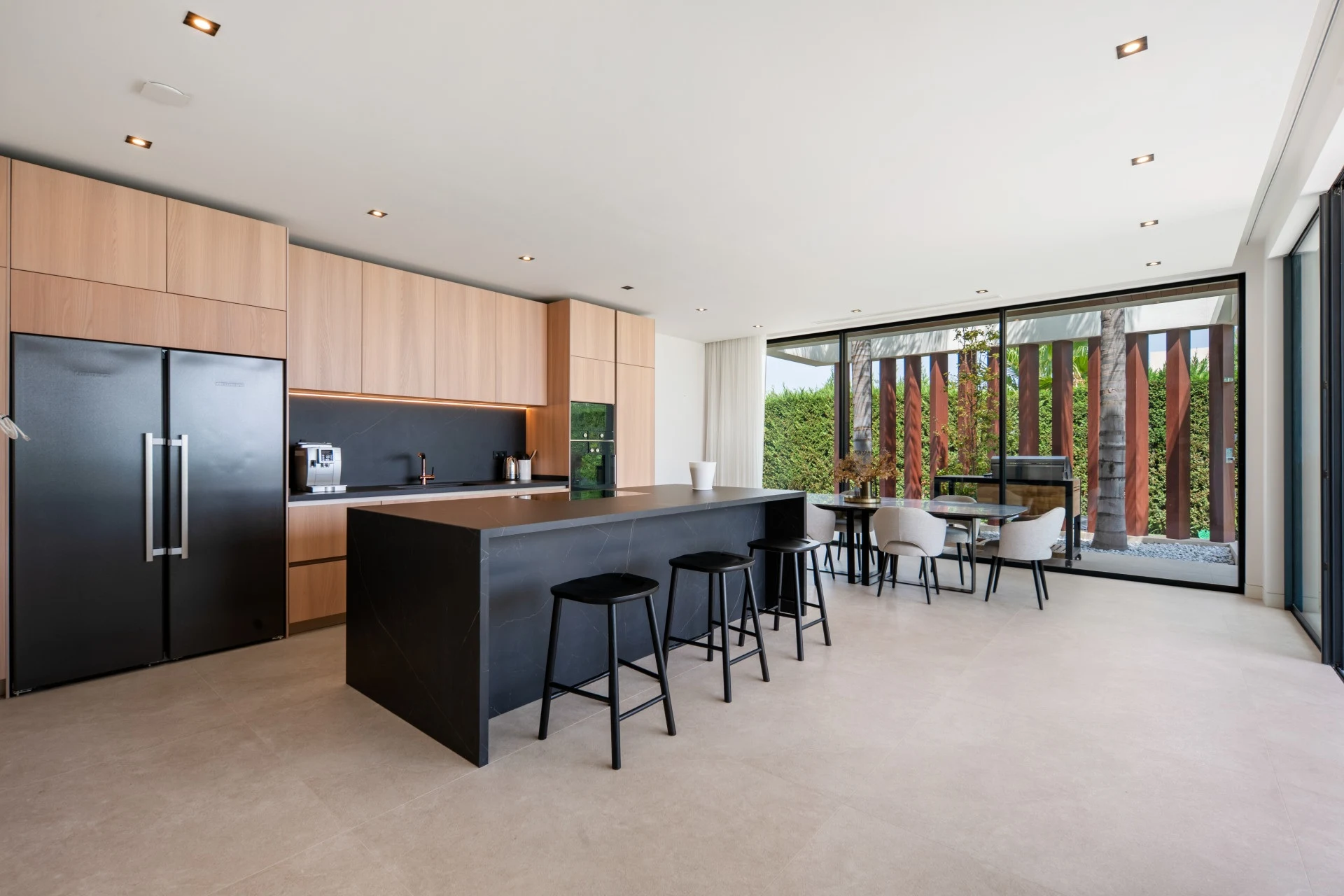 Contemporary kitchen with timber cabinetry and central island