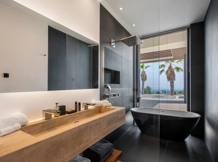 Bathroom with freestanding bath and twin-basin vanity