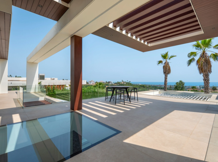 Upper terrace with pergola and views towards the coast