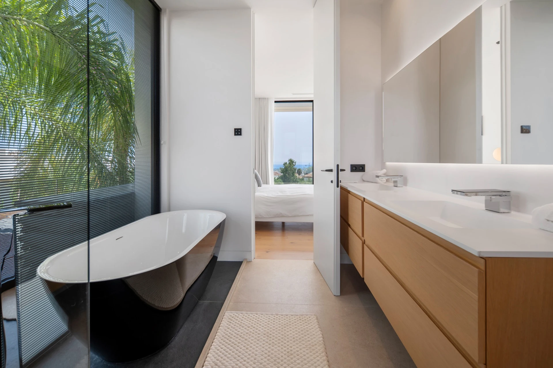 Bathroom with freestanding bath and fitted vanity