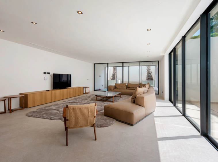 Additional lounge with large windows and timber furnishings
