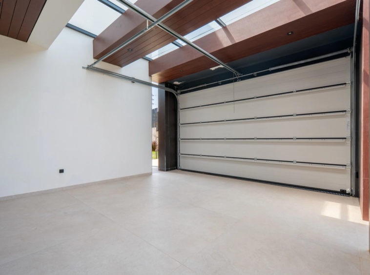 Enclosed garage with sectional vehicle door