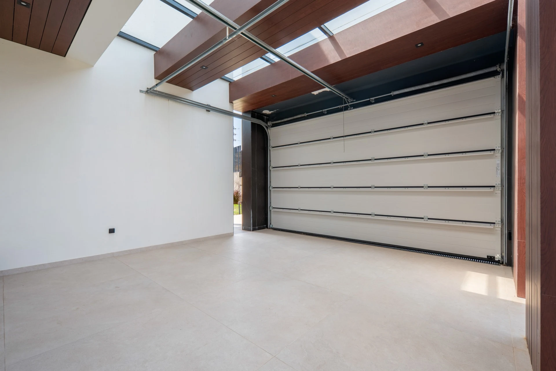 Enclosed garage with sectional vehicle door