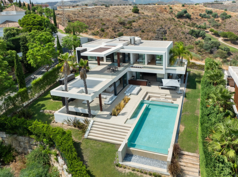 Elevated view of the villa, pool and surrounding garden